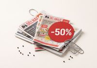 Stapel folders met -50% actie